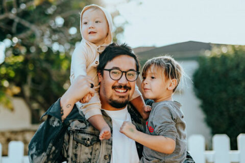 man holding his kids