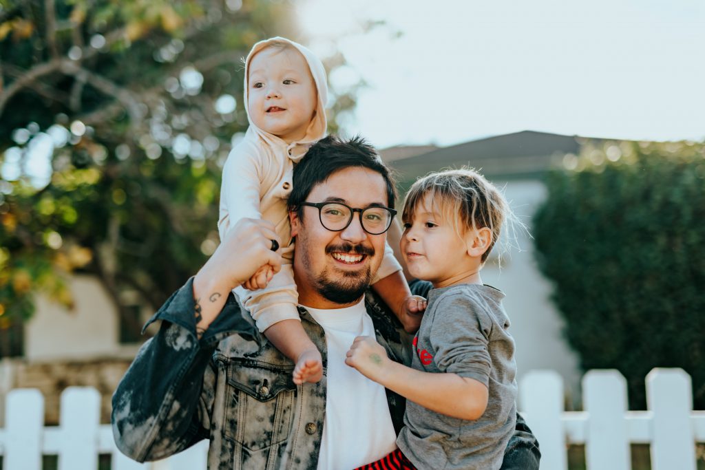 man holding his kids