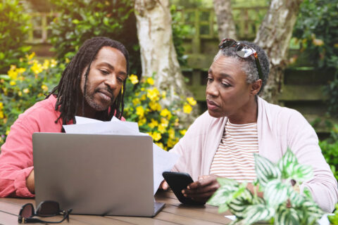 Couple estate planning with laptop