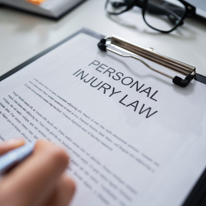 Lawyer in Ogden, UT, reading personal injury law paperwork