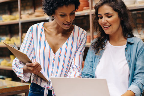 Two women discussing business