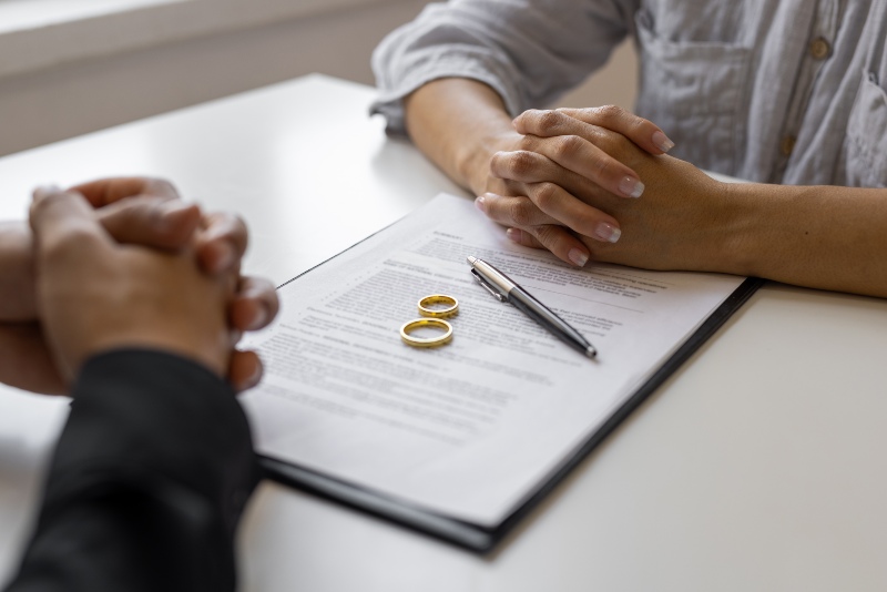 Lawyer with divorce agreement and wedding rings in Ogden, UT