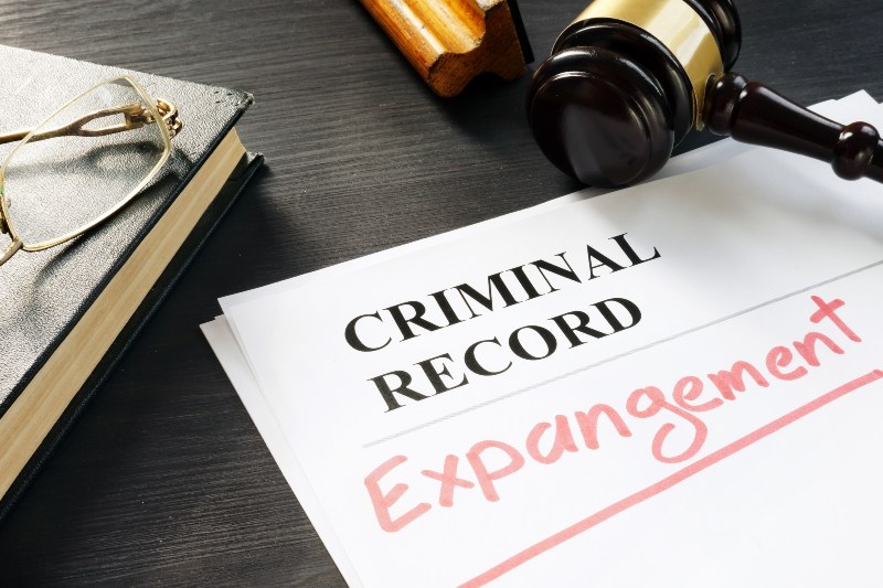 Criminal record expungement legal document with a judge's gavel and law book in Ogden, UT