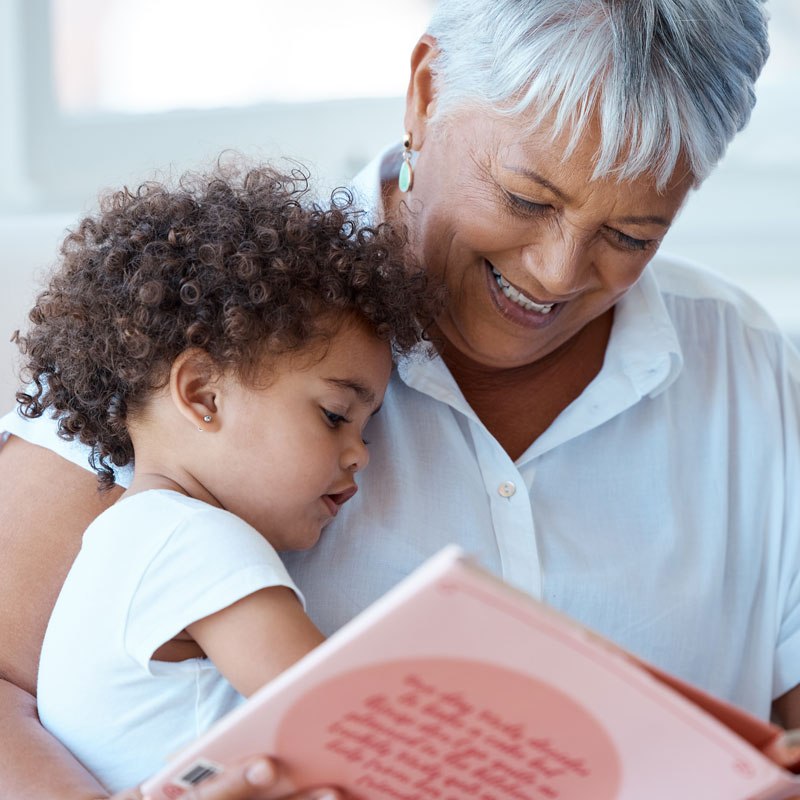 An adult reading with a child symbolizes support for grandparents' rights in Ogden, Utah